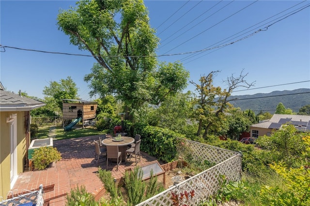 3316 Henrietta Ave, La Crescenta, CA 91214 - view of yard featuring a playground, a patio, a mountain view, fence, and outdoor dining area