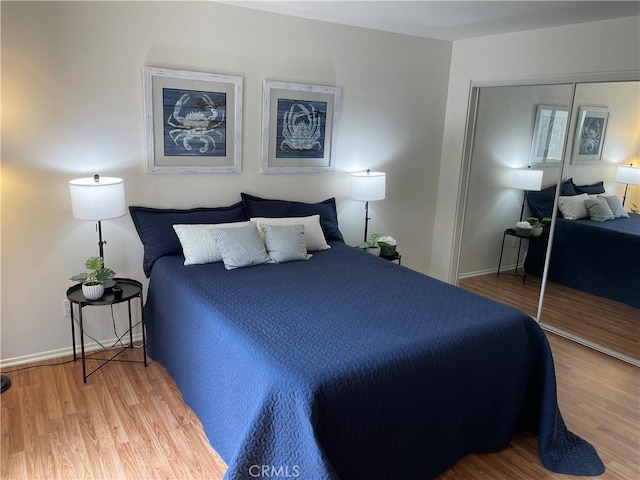 21203 Camelia Unit 34, Lake Forest, CA 92630 - bedroom featuring wood finished floors, a closet, and baseboards