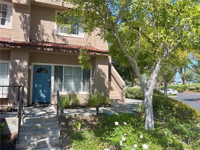 21203 Camelia Unit 34, Lake Forest, CA 92630 - view of front of property featuring stucco siding and a tiled roof