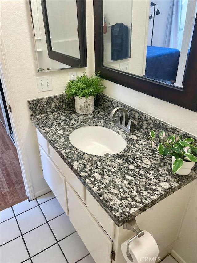 21203 Camelia Unit 34, Lake Forest, CA 92630 - bathroom with vanity, tile patterned flooring, and baseboards