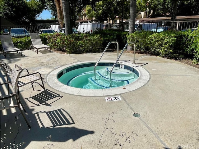 21203 Camelia Unit 34, Lake Forest, CA 92630 - view of swimming pool with fence, a community hot tub, and a patio area