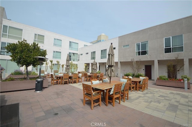 view of property's community featuring outdoor dining area