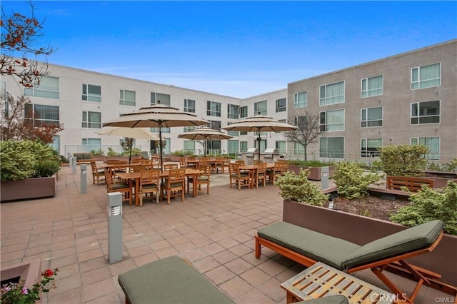 surrounding community with outdoor dining area and a patio