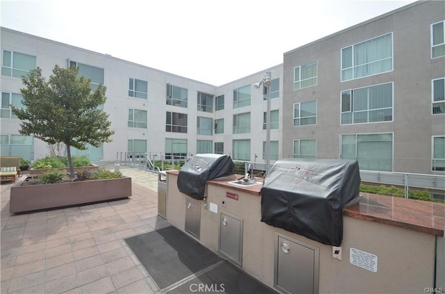 view of patio / terrace with grilling area and exterior kitchen