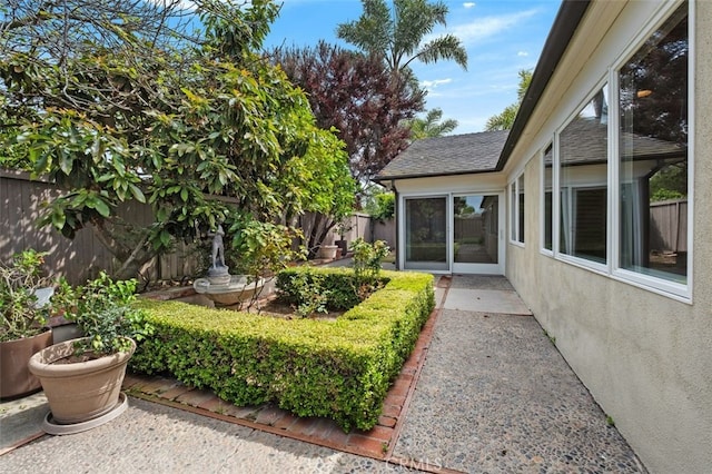 fenced backyard with a patio