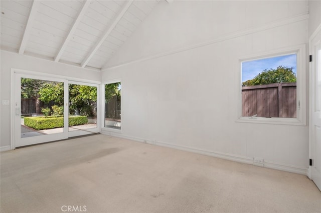 spare room featuring carpet floors, beam ceiling, wooden ceiling, baseboards, and high vaulted ceiling