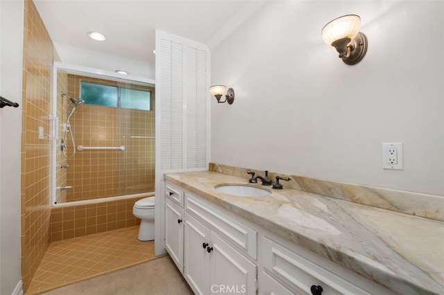 full bathroom featuring vanity, toilet, tiled shower / bath combo, ornamental molding, and recessed lighting