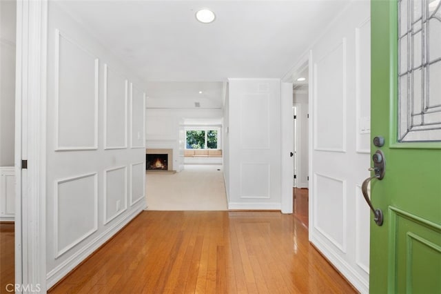 corridor featuring hardwood / wood-style floors and recessed lighting