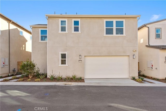 317 Sora, Irvine, CA 92618 - view of front of property with stucco siding, a garage, and concrete driveway