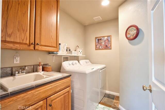 48208 Tanglewood Ct, Aguanga, CA 92536 - laundry room with washing machine and clothes dryer, cabinet space, and baseboards