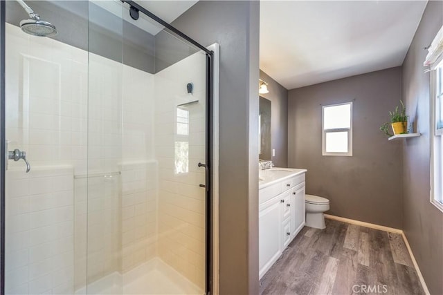 80 Great Lawn, Irvine, CA 92620 - full bath with wood finished floors, a shower stall, toilet, vanity, and baseboards