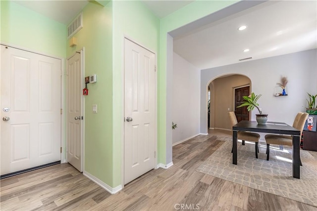80 Great Lawn, Irvine, CA 92620 - hallway with arched walkways, light wood-style flooring, baseboards, and recessed lighting
