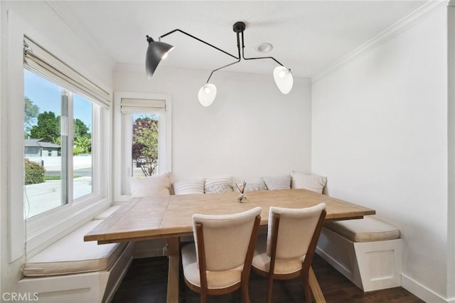 18356 Friar St, Tarzana, CA 91335 - dining room with breakfast area, ornamental molding, dark wood-style floors, and baseboards