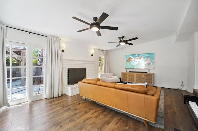 18356 Friar St, Tarzana, CA 91335 - living room featuring plenty of natural light, dark wood finished floors, ceiling fan, and a fireplace