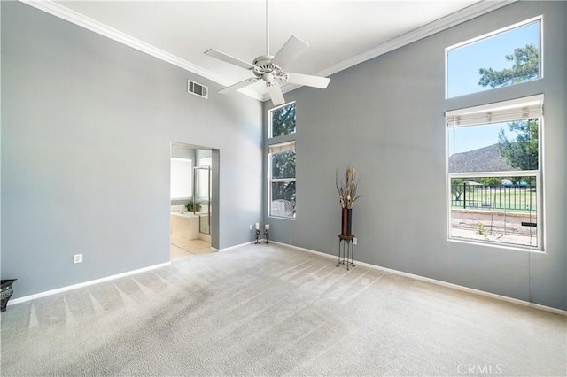 29365 Sparkling Dr, Menifee, CA 92584 - unfurnished room featuring light carpet, a high ceiling, baseboards, a ceiling fan, and ornamental molding