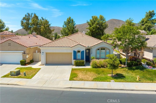 29365 Sparkling Dr, Menifee, CA 92584 - mediterranean / spanish-style home with a garage, concrete driveway, a mountain view, and stucco siding