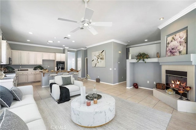 29365 Sparkling Dr, Menifee, CA 92584 - living room featuring light tile patterned floors, ornamental molding, recessed lighting, a ceiling fan, and a fireplace