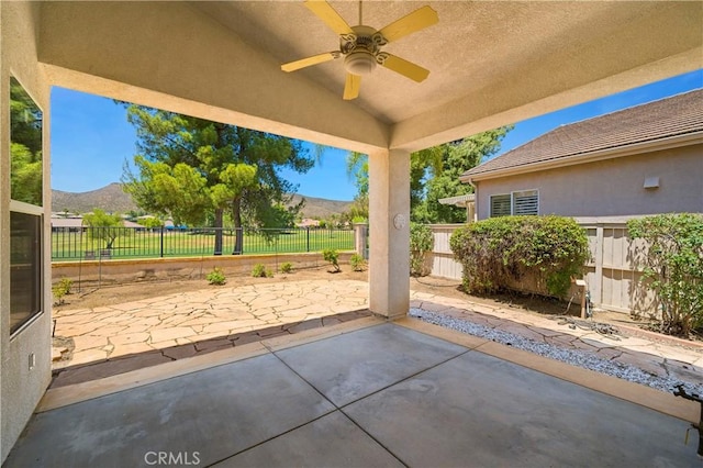 29365 Sparkling Dr, Menifee, CA 92584 - fenced backyard with a patio area, a mountain view, and a ceiling fan