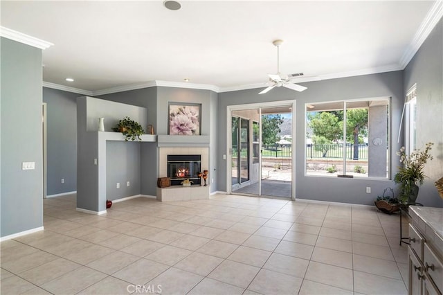 29365 Sparkling Dr, Menifee, CA 92584 - unfurnished living room with ceiling fan, light tile patterned floors, a tile fireplace, crown molding, and baseboards