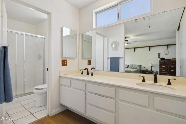 1093 Hickory View Cir, Camarillo, CA 93012 - ensuite bathroom with a ceiling fan, a shower stall, and double vanity