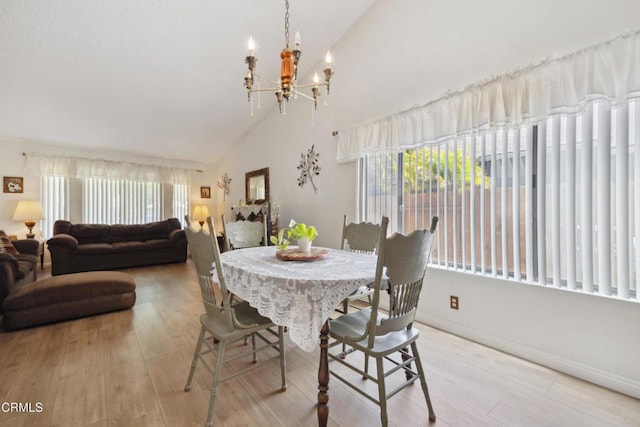1093 Hickory View Cir, Camarillo, CA 93012 - dining area with a chandelier, high vaulted ceiling, wood finished floors, and baseboards