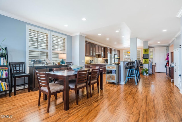 1541 Windshore Way, Oxnard, CA 93035 - dining area with ornamental molding, recessed lighting, light wood-style flooring, and plenty of natural light