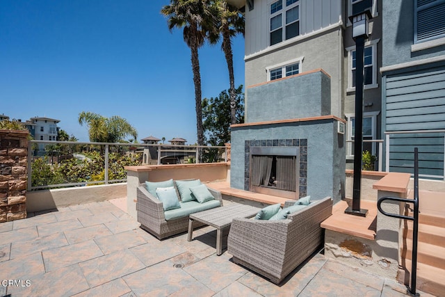 1541 Windshore Way, Oxnard, CA 93035 - view of patio / terrace with an outdoor living space with a fireplace
