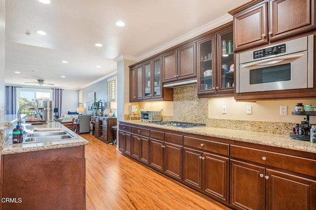 1541 Windshore Way, Oxnard, CA 93035 - kitchen with a sink, crown molding, appliances with stainless steel finishes, light wood-type flooring, and recessed lighting
