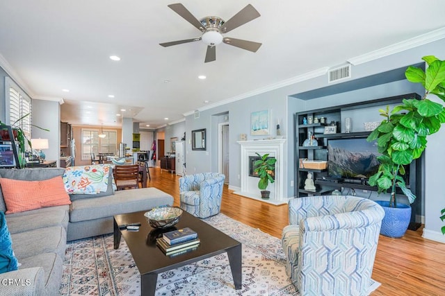 1541 Windshore Way, Oxnard, CA 93035 - living room featuring ceiling fan, light wood-type flooring, ornamental molding, recessed lighting, and baseboards