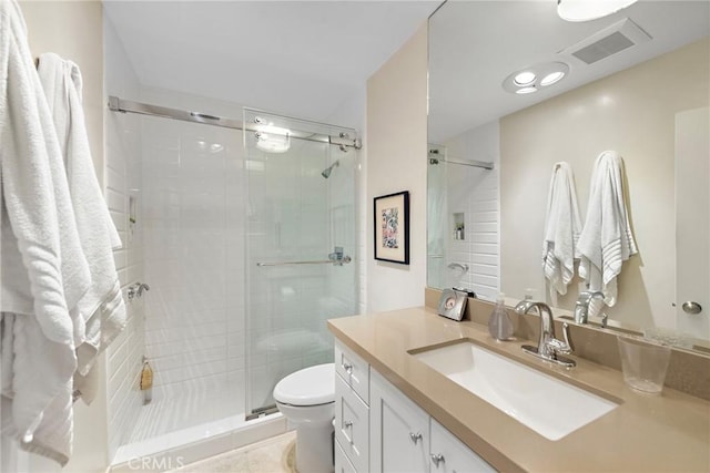 21703 Ocean Vista Dr Unit 102, Laguna Beach, CA 92651 - bathroom with toilet, vanity, a stall shower, and tile patterned flooring