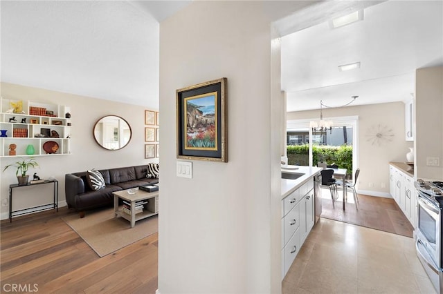 21703 Ocean Vista Dr Unit 102, Laguna Beach, CA 92651 - corridor featuring a chandelier