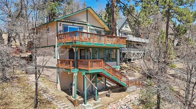1179 Ridge Rd, Fawnskin, CA 92333 - rear view of property with stairway and a wooden deck