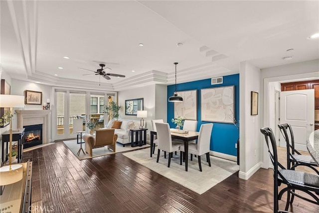 12044 Hoffman St Unit 204, Studio City, CA 91604 - dining space featuring a tray ceiling, dark wood-style floors, baseboards, a glass covered fireplace, and recessed lighting