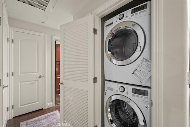 12044 Hoffman St Unit 204, Studio City, CA 91604 - laundry area featuring stacked washer and clothes dryer and wood finished floors
