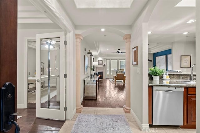 12044 Hoffman St Unit 204, Studio City, CA 91604 - bar area with stainless steel dishwasher, a ceiling fan, decorative columns, a sink, and a lit fireplace