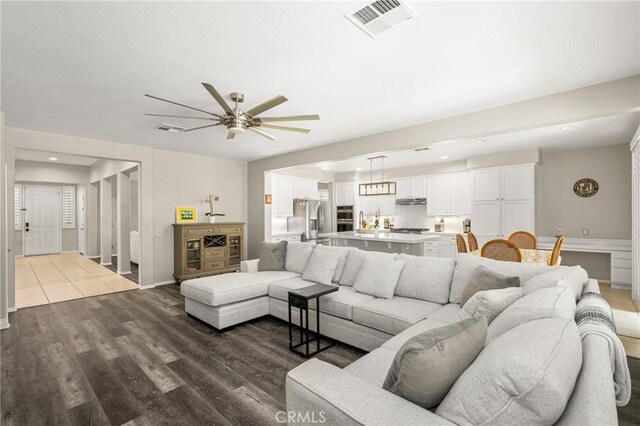 32748 Stonefield Ln, Temecula, CA 92592 - living room featuring ceiling fan and wood finished floors