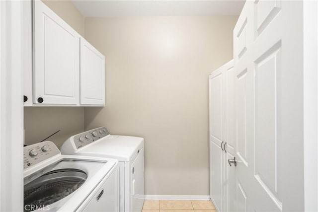 32748 Stonefield Ln, Temecula, CA 92592 - laundry area featuring washer and clothes dryer, cabinet space, baseboards, and light tile patterned floors