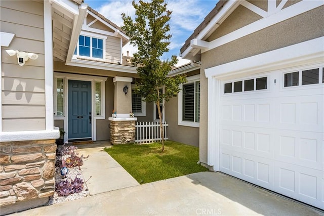 32748 Stonefield Ln, Temecula, CA 92592 - entrance to property featuring a garage, stucco siding, and stone siding