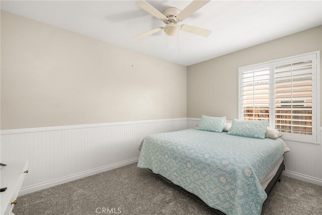 32748 Stonefield Ln, Temecula, CA 92592 - bedroom with carpet flooring, wainscoting, a ceiling fan, and baseboards