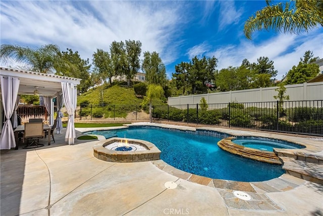 32748 Stonefield Ln, Temecula, CA 92592 - view of swimming pool featuring a patio, a pool with connected hot tub, a fenced backyard, outdoor dining space, and an outdoor fire pit