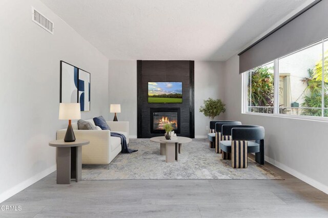 8534 Beverly Dr, San Gabriel, CA 91775 - living room featuring wood finished floors and a large fireplace
