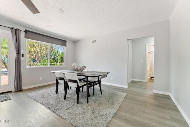 8534 Beverly Dr, San Gabriel, CA 91775 - dining space featuring a textured ceiling, light wood-style flooring, and ceiling fan