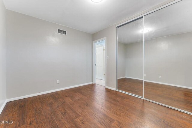 8534 Beverly Dr, San Gabriel, CA 91775 - unfurnished bedroom featuring a closet and wood finished floors