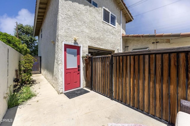 8534 Beverly Dr, San Gabriel, CA 91775 - rear view of property with stucco siding, a gate, and a patio