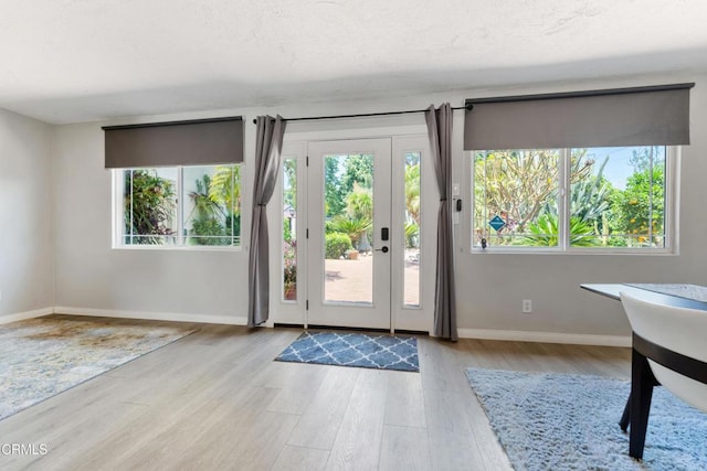 8534 Beverly Dr, San Gabriel, CA 91775 - doorway to outside with wood finished floors and a textured ceiling