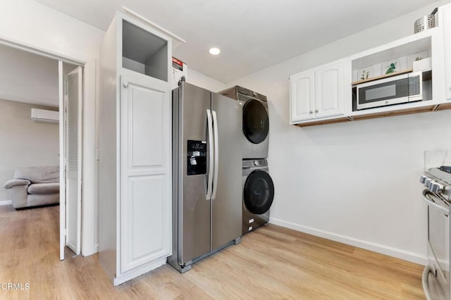 8534 Beverly Dr, San Gabriel, CA 91775 - laundry area with a wall mounted air conditioner, stacked washer / dryer, light wood-style flooring, and recessed lighting