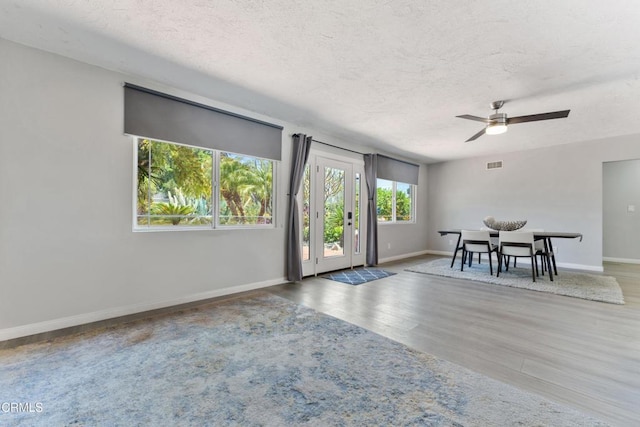 8534 Beverly Dr, San Gabriel, CA 91775 - dining room with a textured ceiling, wood finished floors, and a ceiling fan