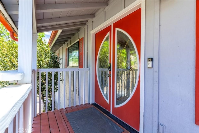 view of exterior entry with covered porch