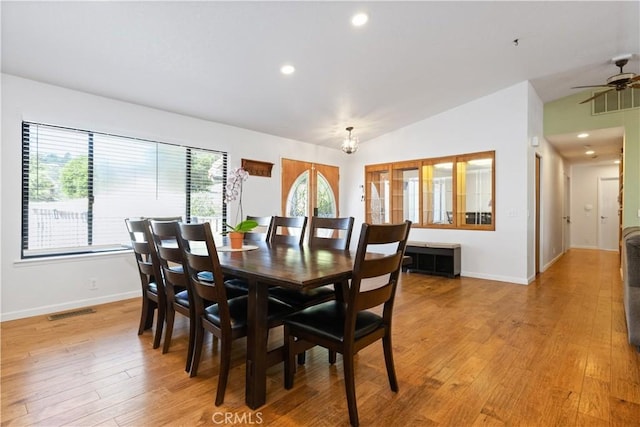 dining room featuring lofted ceiling, baseboards, light wood-style floors, recessed lighting, and a ceiling fan