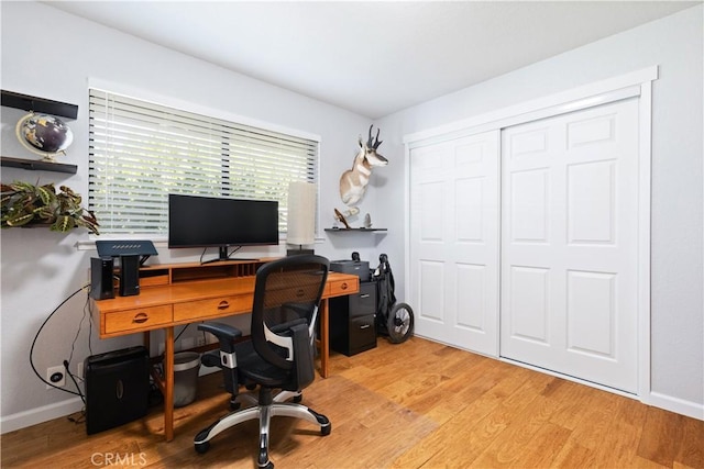 office featuring light wood finished floors and baseboards